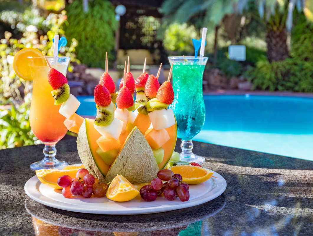 Photo of a fruit selection and cocktails at a pool. NightOwl Media, Corporate Photography. Photographer based in Pretoria & Johannesburg, Gauteng, South Africa. Videographer, Marketing, Incentive, travel, lodge, hotel, 